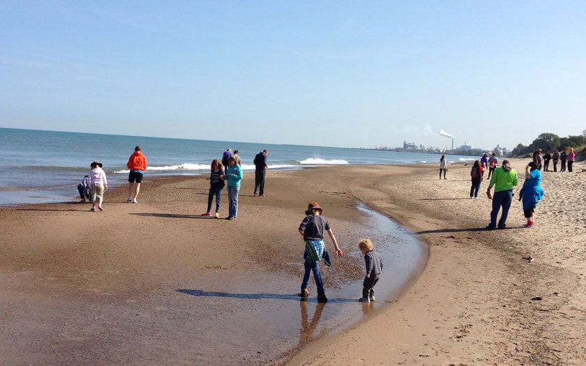 Families hike on the beach over foredunes and through forests on a trip to the Indiana Dunes